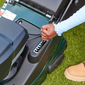 Image of a lawn mower with adjustable settings. Adjustable settings are a key consideration for choosing the right lawn mower for your needs.
